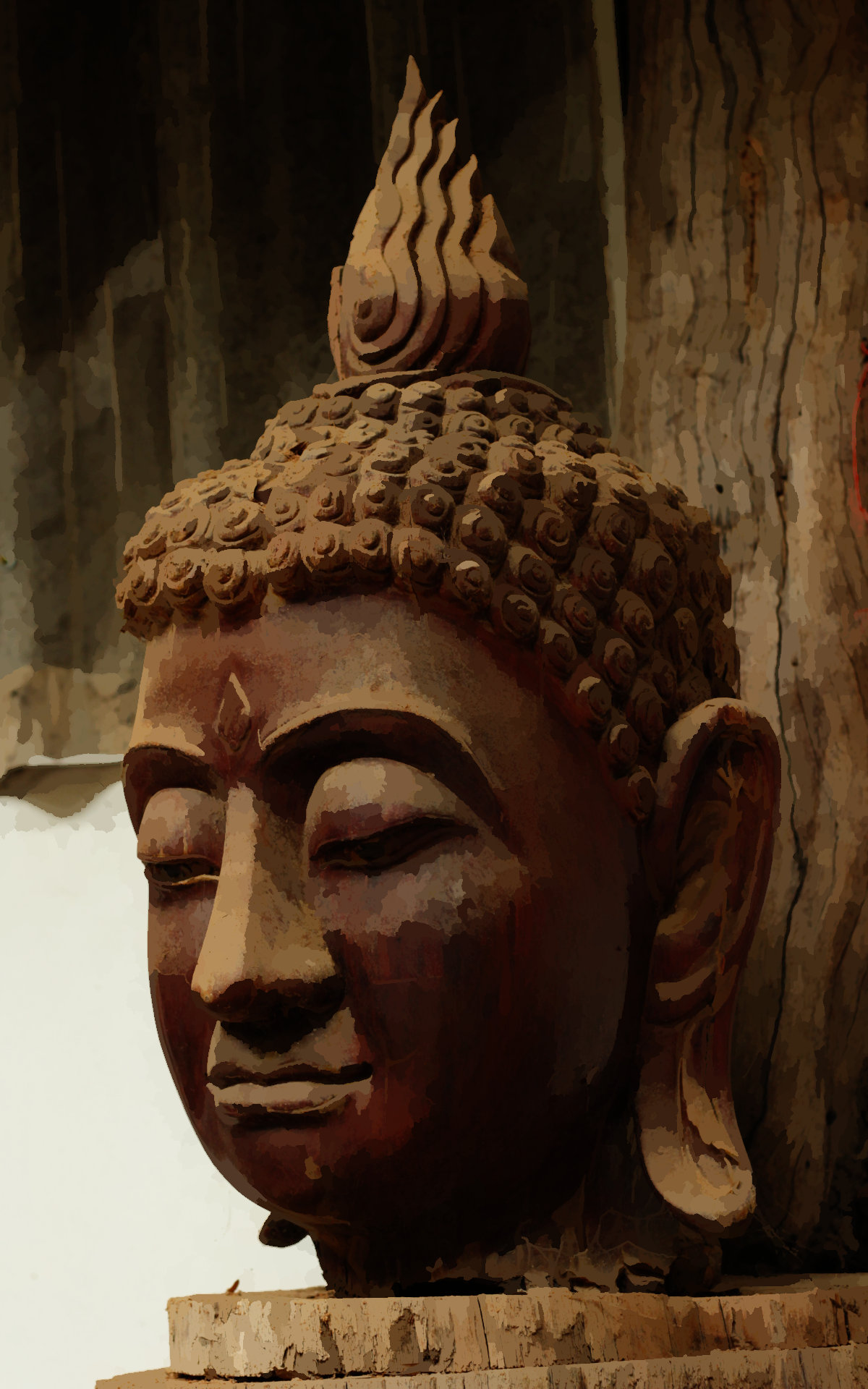 A wooden Buddha head