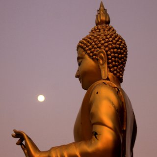 The Buddha and a full moon as shot