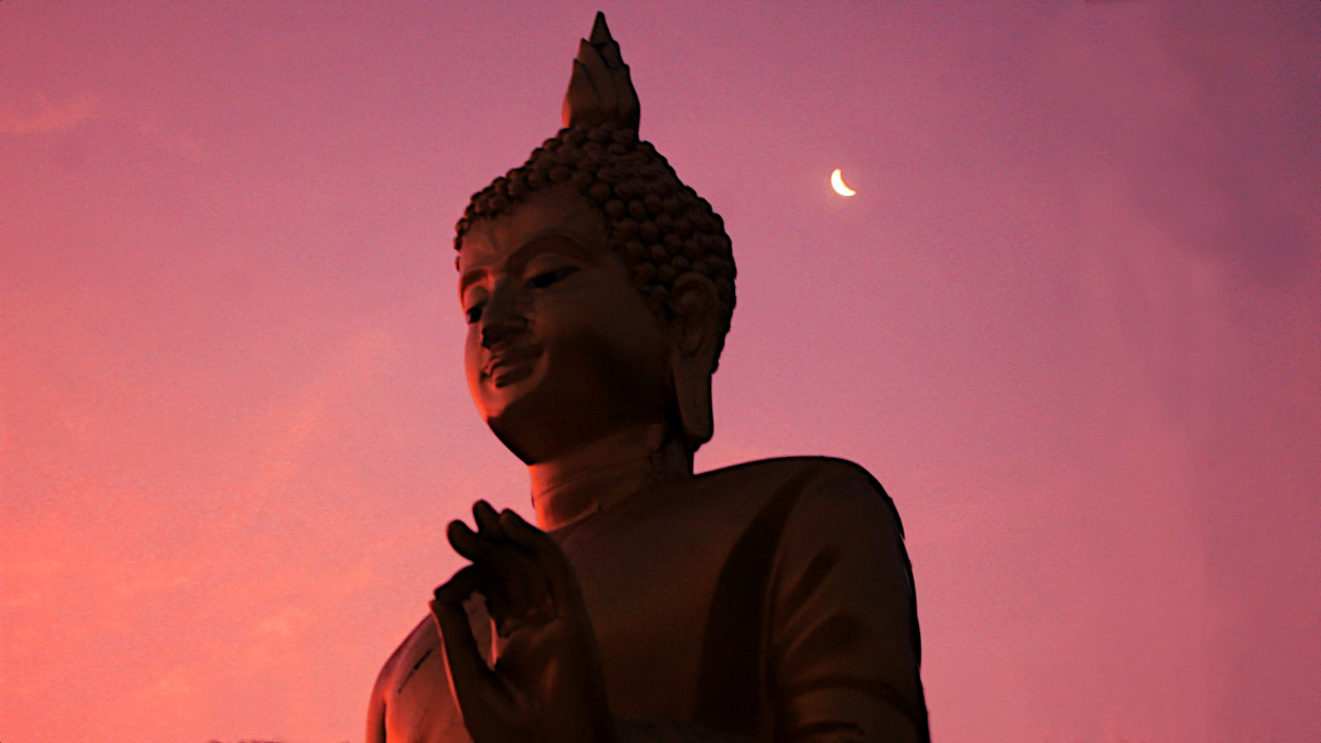 The Buddha and a crescent moon